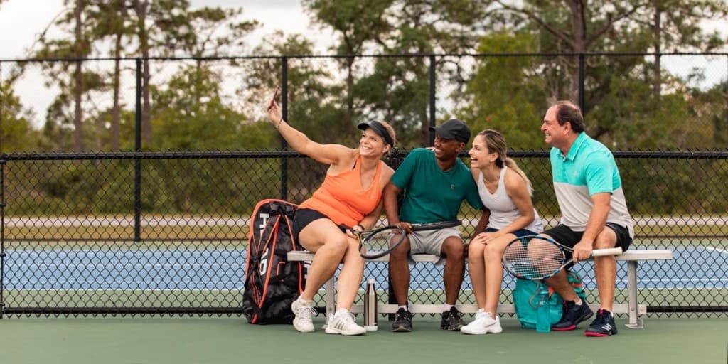 Tennis players sitting together between matches